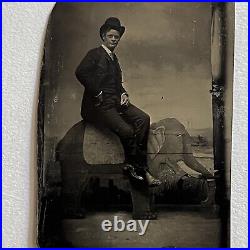 Antique Tintype Photograph Dapper Man Bowler Hat Riding Fun Odd Wood Elephant